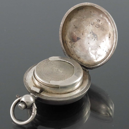 148 - An Edwardian silver sovereign case, Birmingham 1907, together with an Indian white metal example, ea... 