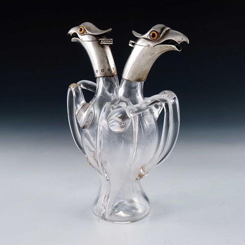 151 - A Victorian novelty silver mounted glass double cruet bottle, Hukin and Heath, Birmingham 1894, mode... 