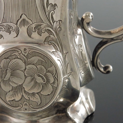 163 - A Victorian silver mug, George Unite, Birmingham 1859, footed ribbed baluster form, circular medalli... 