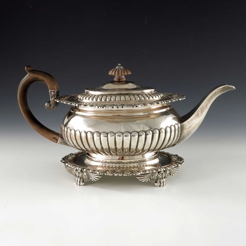 168 - A George III silver teapot on stand, J E Terrey and Co., London 1817, squat ovoid form, half reeded,... 