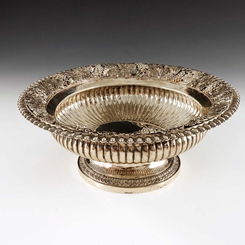 182 - A George III silver bowl, William Elliott, London 1817, squat Campana form, reeded, with a wide ever... 