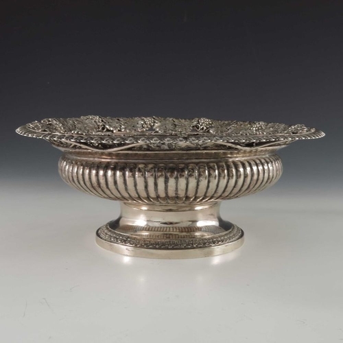 182 - A George III silver bowl, William Elliott, London 1817, squat Campana form, reeded, with a wide ever... 