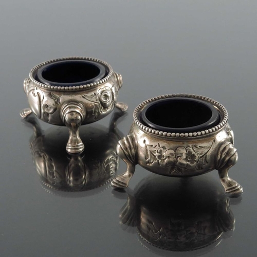 189 - A pair of Victorian silver salt cellars, Beare Falcke, London 1866, cauldron form, embossed with flo... 