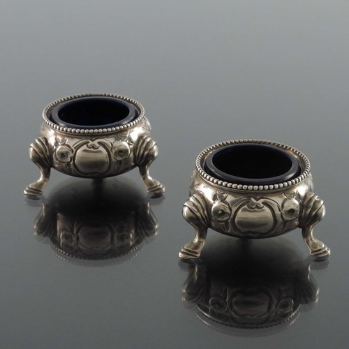 189 - A pair of Victorian silver salt cellars, Beare Falcke, London 1866, cauldron form, embossed with flo... 