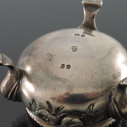 189 - A pair of Victorian silver salt cellars, Beare Falcke, London 1866, cauldron form, embossed with flo... 