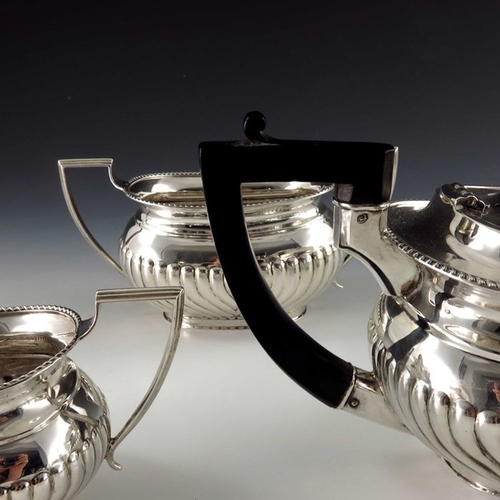 191A - A George V silver three piece tea set, Copper Brothers and Sons, Sheffield 1926, half reeded boat fo... 