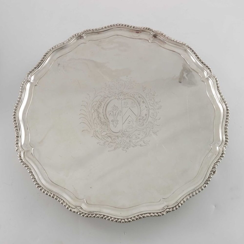 196 - A pair of George III silver salvers, Thomas Hannam, London 1765, circular with ogee gadrooned and fl... 