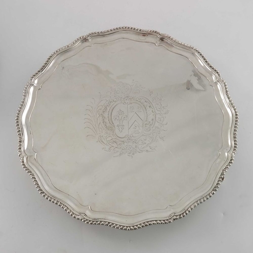 196 - A pair of George III silver salvers, Thomas Hannam, London 1765, circular with ogee gadrooned and fl... 