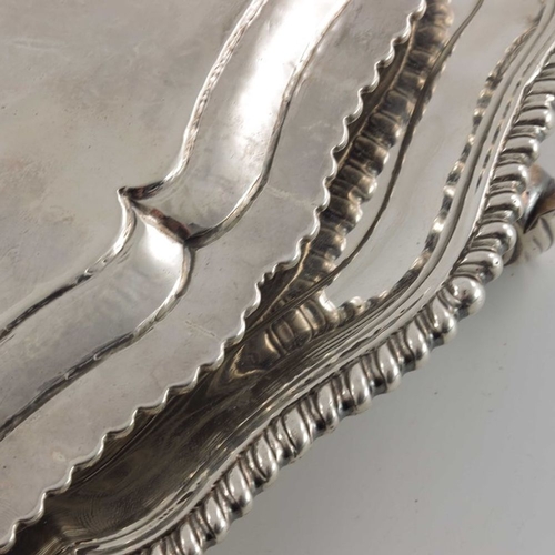 196 - A pair of George III silver salvers, Thomas Hannam, London 1765, circular with ogee gadrooned and fl... 