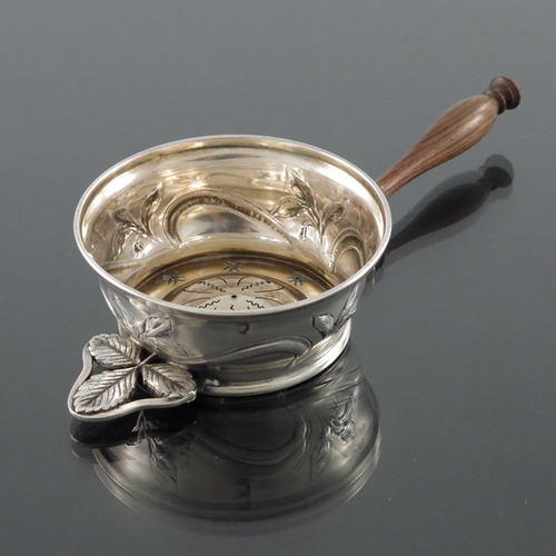 214 - A French Art Nouveau silver and gilt tea strainer, Charles Forgelot, Paris circa 1905, the circular ... 