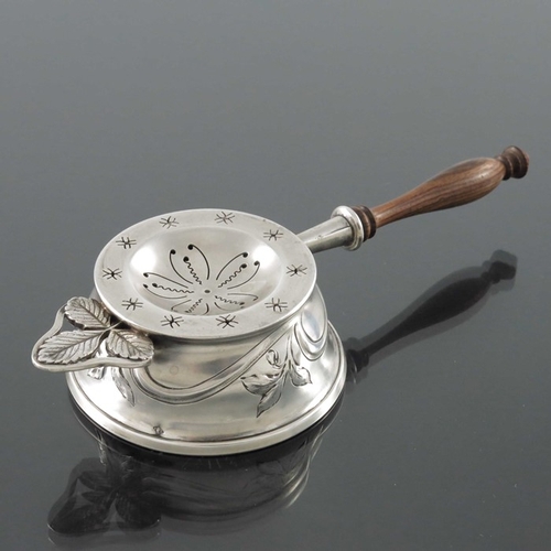 214 - A French Art Nouveau silver and gilt tea strainer, Charles Forgelot, Paris circa 1905, the circular ... 