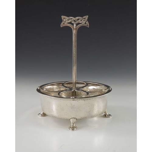 216 - Archibald Knox for Liberty and Co., an Arts and Crafts silver egg stand or cruet, Birmingham 1900, t... 