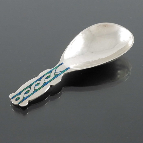 217 - Archibald Knox for Liberty and Co., an Arts and Crafts silver and enamelled caddy spoon, Birmingham ... 