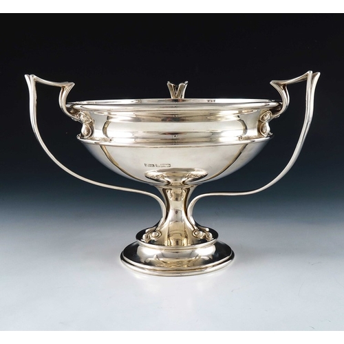 221 - An Arts and Crafts silver pedestal bowl, Joseph Rodgers, Sheffield 1907, the ogee rimmed bowl with t... 