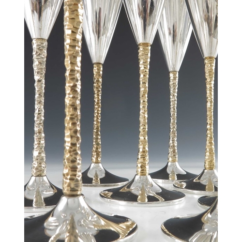 238 - Stuart Devlin, a matched set of twelve Modernist silver and parcel gilt champagne flutes, London 197... 