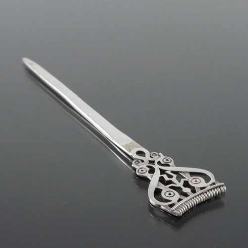 240 - Ola M Gorie, a Scottish Iona style silver letter opener, Orkney, assay Edinburgh 1985, the open term... 