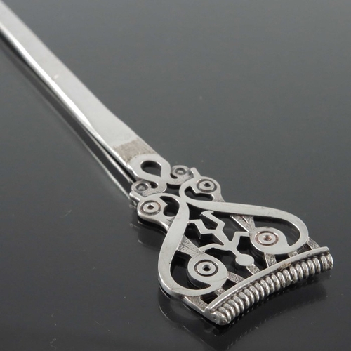 240 - Ola M Gorie, a Scottish Iona style silver letter opener, Orkney, assay Edinburgh 1985, the open term... 