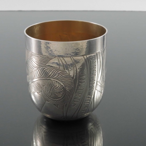 241 - Rod Kelly, a Modernist engraved silver beaker, London 1997, rounded tot form, planished and decorate... 