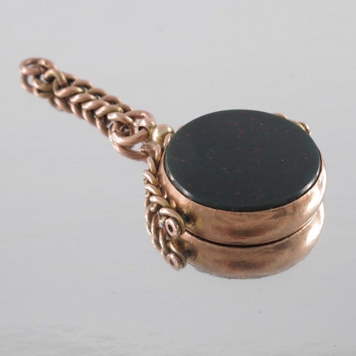 242 - A 9 carat gold and bloodstone swivel fob, chased to the closed back, on rigid chain hoop fitting, 6.... 