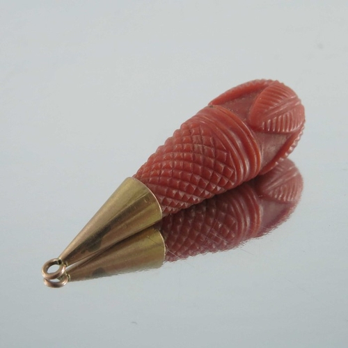 243 - A 19th century gold and carved coral brooch, together with a carved drop pendant, 4cm long (2)