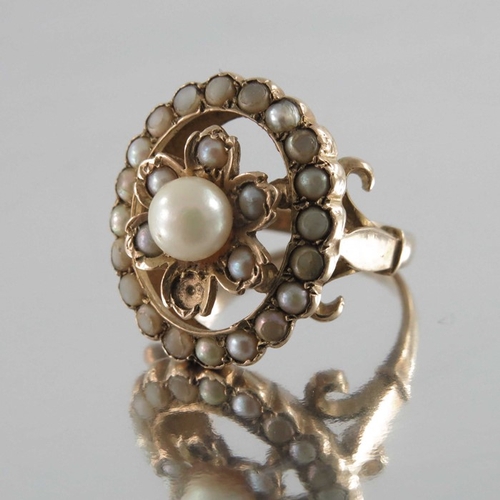 245 - A Victorian gold and seed pearl ring, the 4cm diameter central pearl within floral setting and pearl... 