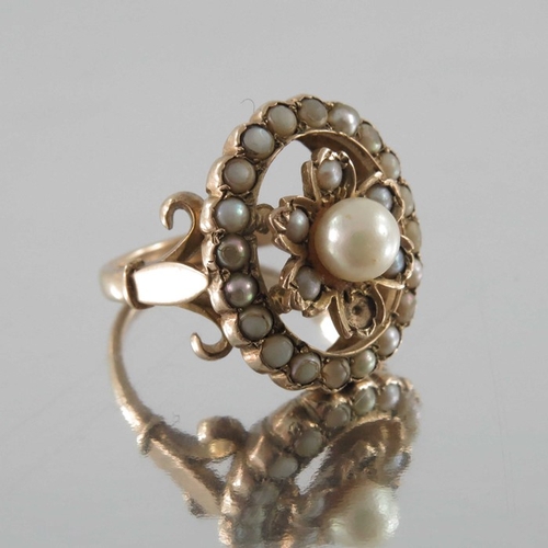 245 - A Victorian gold and seed pearl ring, the 4cm diameter central pearl within floral setting and pearl... 