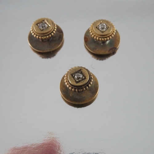 248 - A set of three late Victorian gold and old cut diamond shirt studs, with ropetwist and beaded bands ... 