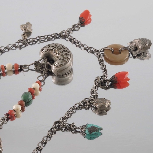 252 - Two Chinese silver and hardstone necklaces, one with charm style pendants including lotus flowers an... 