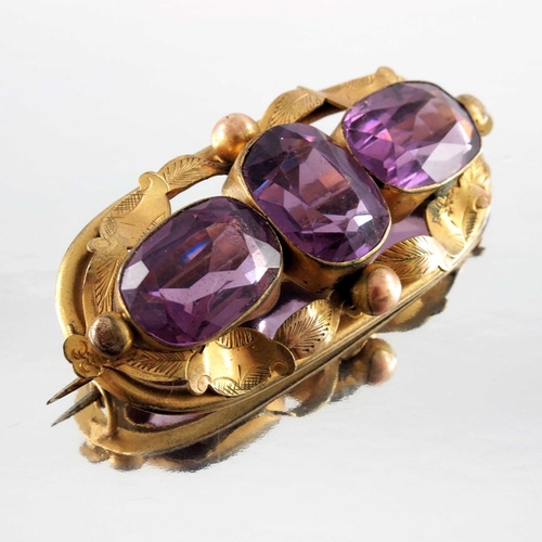 264 - Four Victorian and later yellow metal and gold brooches, including amethyst set and shell cameo exam... 