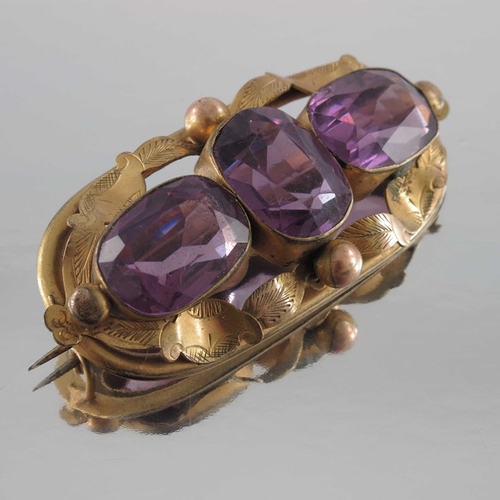 264 - Four Victorian and later yellow metal and gold brooches, including amethyst set and shell cameo exam... 