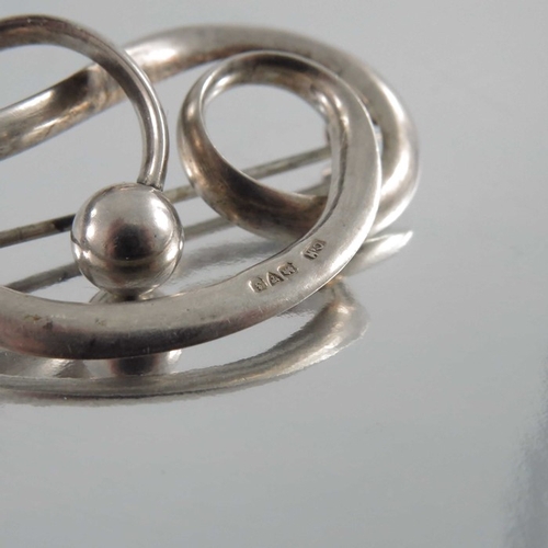 270 - Charles Horner, an Arts and Crafts silver brooch, Chester 1909, open knotted ribbon with spherical t... 