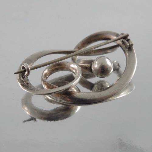 270 - Charles Horner, an Arts and Crafts silver brooch, Chester 1909, open knotted ribbon with spherical t... 