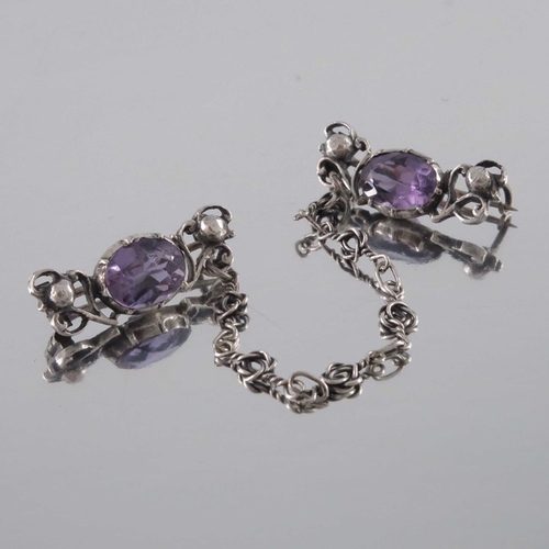 278 - Sybil Dunlop (attributed), an Arts and Crafts silver and amethyst chain brooch, circa 1910, the two ... 