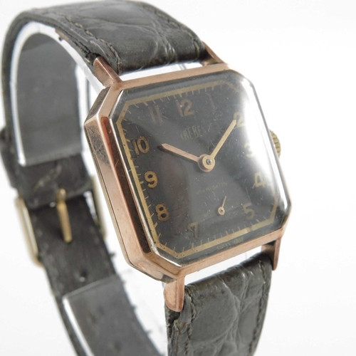 291 - Trebex, a 9 carat gold wrist watch, square with chamfered corners, black dial and arabic numerals wi... 