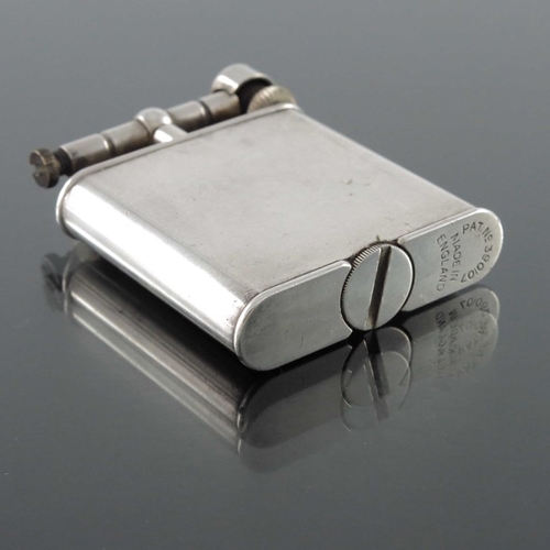 296 - Alfred Dunhill, a New Dunhill lift arm lighter, silver plated, circa 1930s, 5.5cm high