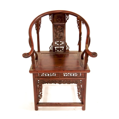 373 - A Chinese hardwood armchair, carved and reticulated with foliate scroll brackets, panel seat, the ba... 