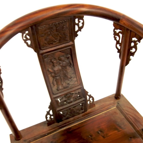 373 - A Chinese hardwood armchair, carved and reticulated with foliate scroll brackets, panel seat, the ba... 