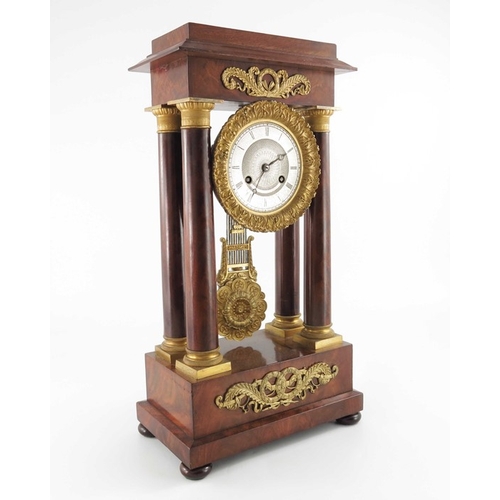 389 - A French Charles X ormolu and flame mahogany portico clock, Empire style, signed Guyerdet, the 6 inc... 