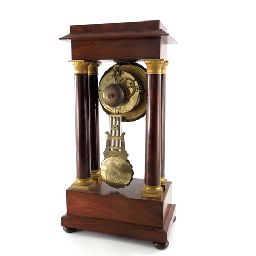 389 - A French Charles X ormolu and flame mahogany portico clock, Empire style, signed Guyerdet, the 6 inc... 