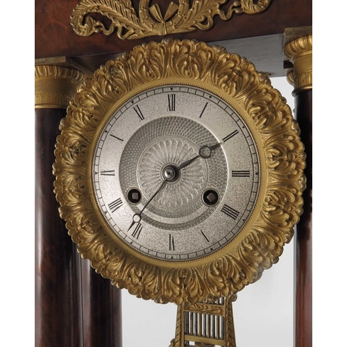 389 - A French Charles X ormolu and flame mahogany portico clock, Empire style, signed Guyerdet, the 6 inc... 