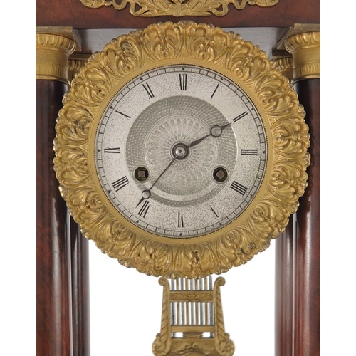 389 - A French Charles X ormolu and flame mahogany portico clock, Empire style, signed Guyerdet, the 6 inc... 