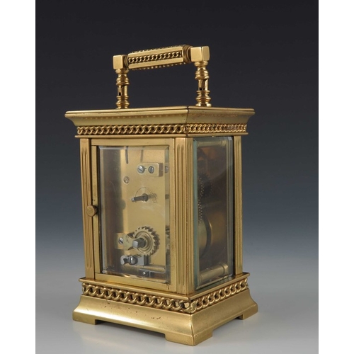 392 - A French gilt brass carriage timepiece, the 1.5 inch cream enamelled dial within an etched fleur de ... 