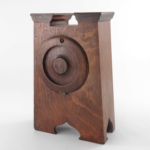 395 - An Arts and Crafts oak and marquetry clock, tapered form with fret carved ogee domed bracket feet, a... 