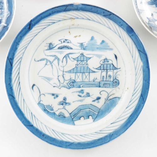 398A - Four Chinese export blue and white plates, 18th century, variously painted with temple landscapes an... 