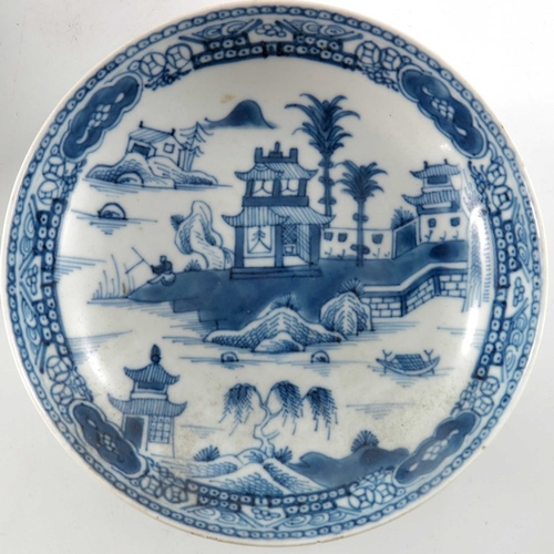 398A - Four Chinese export blue and white plates, 18th century, variously painted with temple landscapes an... 