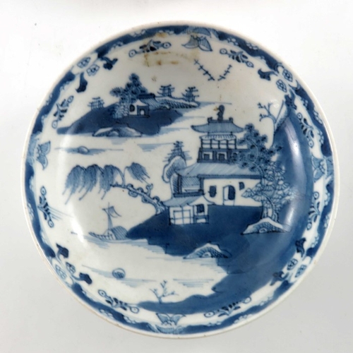 398A - Four Chinese export blue and white plates, 18th century, variously painted with temple landscapes an... 