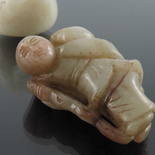 406 - Three Chinese jade carvings, including man with a stick, man with monkey and a duck, pierced and eng... 