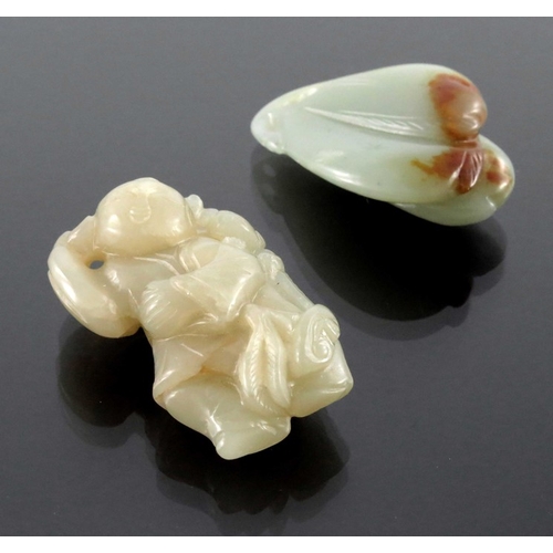 410 - Two Chinese carved jade pendants, one as a group of peaches, the other of a man and boy with ruyi sc... 