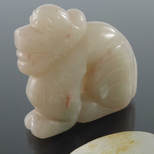 411 - Four Chinese jade carvings and pendants, including fish, dog and peaches, pierced and incised, 8.5cm... 