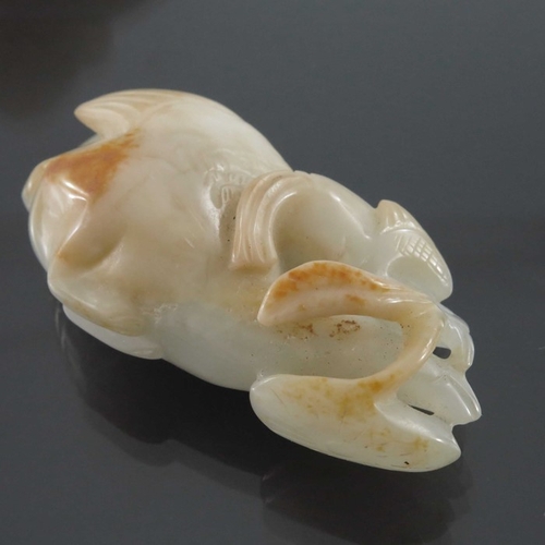 411 - Four Chinese jade carvings and pendants, including fish, dog and peaches, pierced and incised, 8.5cm... 